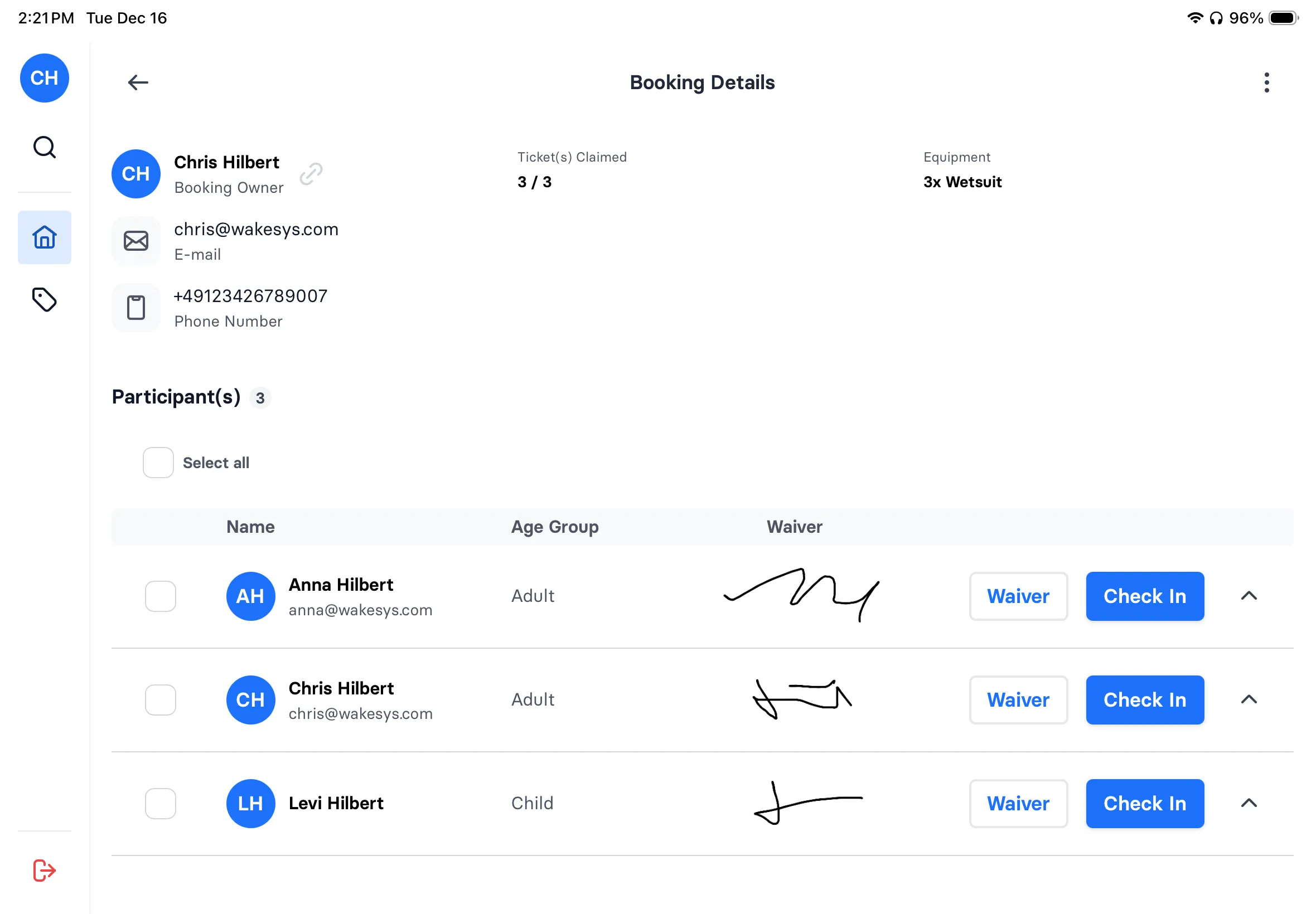 Staff check-in screen showing three participants, each with the signature they drew displayed next to their name
